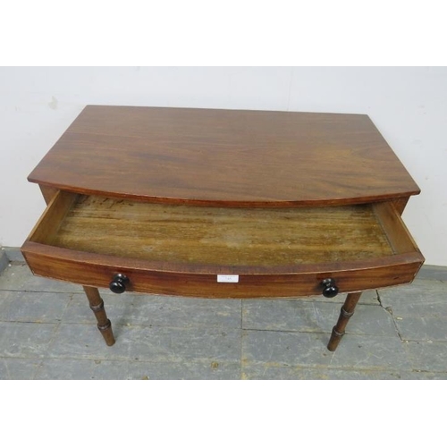 745 - A George IV mahogany bow-fronted hall table, housing one long cock-beaded, oak-lined drawer with tur... 