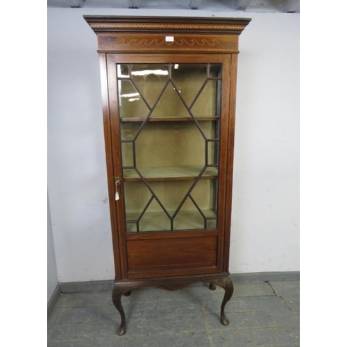 746 - An Edwardian mahogany glazed display cabinet, the stepped cornice with marquetry inlaid frieze, abov... 