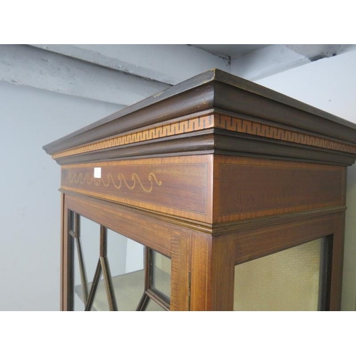 746 - An Edwardian mahogany glazed display cabinet, the stepped cornice with marquetry inlaid frieze, abov... 