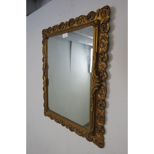 759 - An antique style rectangular wall mirror, within a gilt gesso surround modelled as scrolling acanthu... 