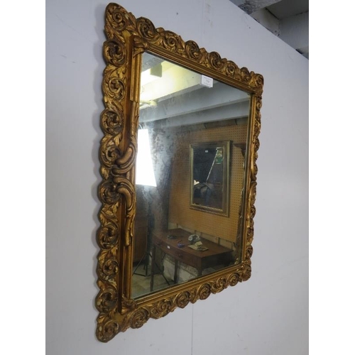 759 - An antique style rectangular wall mirror, within a gilt gesso surround modelled as scrolling acanthu... 