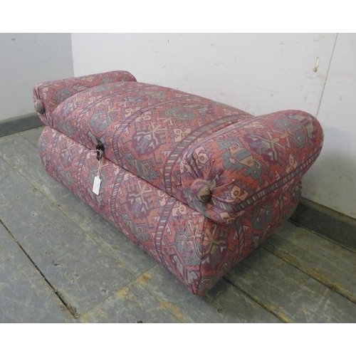 777 - A small vintage window seat/ottoman covered in multi-coloured patterned tapestry material, on bun fe... 