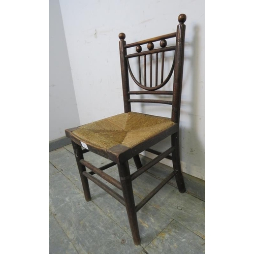 780 - A rare 19th century Arts & Crafts child’s ‘Sussex’ chair, with rush seat, on turned supports with do... 