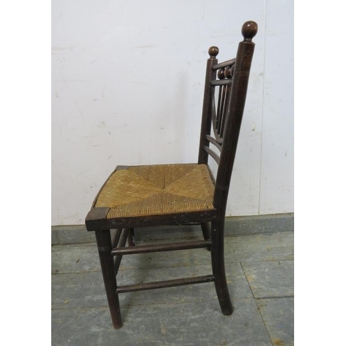 780 - A rare 19th century Arts & Crafts child’s ‘Sussex’ chair, with rush seat, on turned supports with do... 