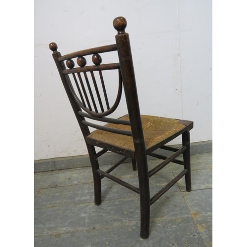 780 - A rare 19th century Arts & Crafts child’s ‘Sussex’ chair, with rush seat, on turned supports with do... 