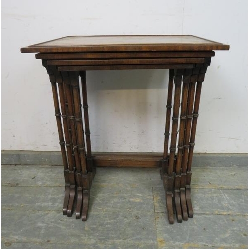 783 - A set of four Edwardian mahogany and rosewood nesting tables, the tops with inlaid flame mahogany pa... 