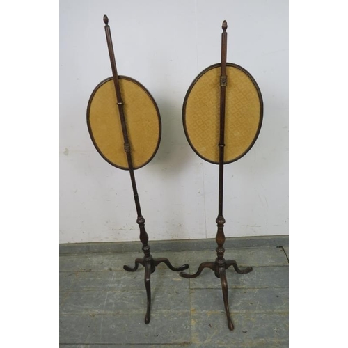 784 - A pair of 19th century mahogany pole screens, having acorn finials and brass fittings, with inset si... 