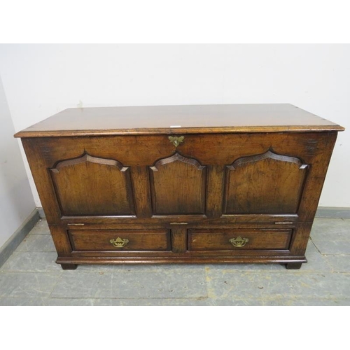 785 - A reproduction oak mule chest in the 18th century style by Titchmarsh & Goodwin, the fall front with... 