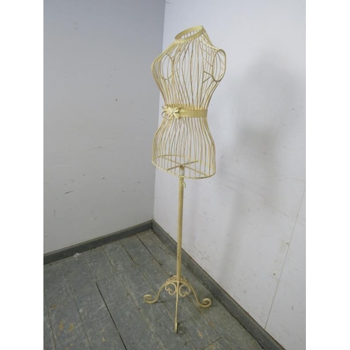 787 - An antique French style wirework shop mannequin, painted cream and distressed, on a scrolled wrought... 