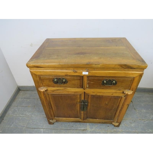 789 - A vintage Chinese hardwood side cabinet, housing two short drawers above twin doors opening onto a l... 