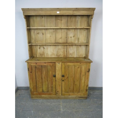 791 - An antique pine cottage sized dresser of unusually narrow proportions, the plate-rack shelving above... 