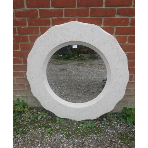 798 - A large circular bathroom mirror within marble effect composite shaped surround.  Diameter 100cm D4c... 