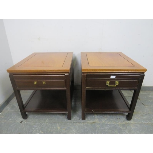 806 - A pair of vintage Chinese hardwood two-tier side tables, each housing one long drawer, on square sup... 