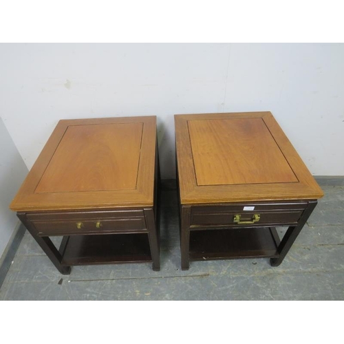 806 - A pair of vintage Chinese hardwood two-tier side tables, each housing one long drawer, on square sup... 