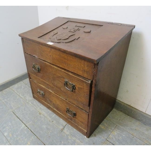 809 - A diminutive bespoke made antique oak chest, the rising lid with relief carved heraldic crest, above... 