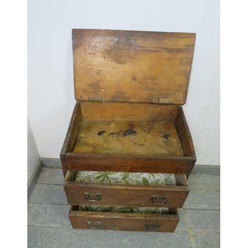 809 - A diminutive bespoke made antique oak chest, the rising lid with relief carved heraldic crest, above... 