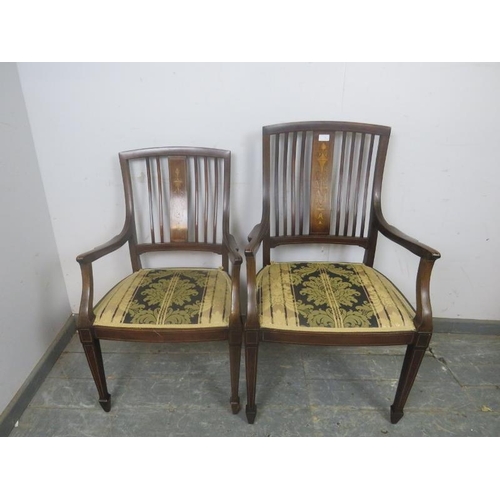 811 - A pair of antique his & hers Sheraton Revival rosewood elbow chairs, the backsplats with Classical m... 