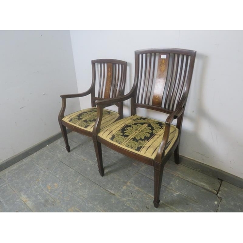 811 - A pair of antique his & hers Sheraton Revival rosewood elbow chairs, the backsplats with Classical m... 