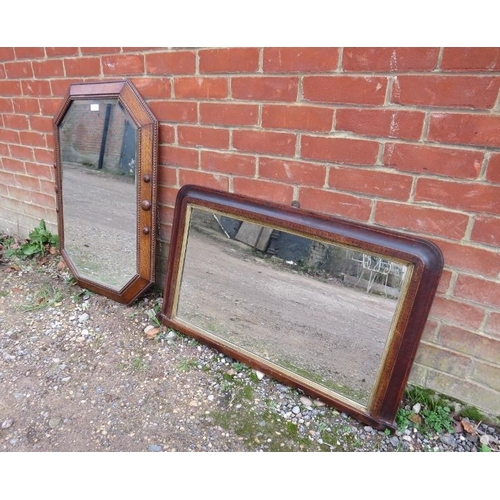 817 - An antique octagonal wall mirror, within an oak surround with beaded edging and roundel decoration. ... 