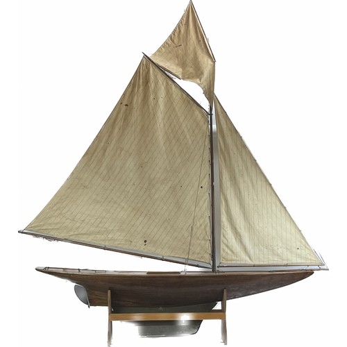 79 - A large vintage model sailing yacht, early 20th century. 181 cm height on stand, 162 cm length.
Cond... 