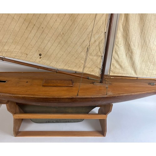 79 - A large vintage model sailing yacht, early 20th century. 181 cm height on stand, 162 cm length.
Cond... 