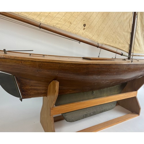 79 - A large vintage model sailing yacht, early 20th century. 181 cm height on stand, 162 cm length.
Cond... 