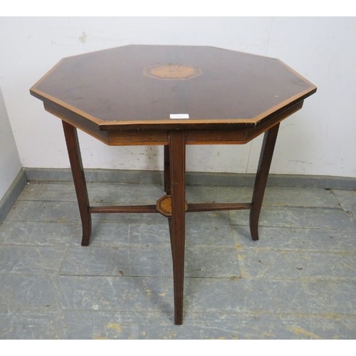 761 - A finely inlaid 19th century mahogany octagonal table with central fan medallions, ebony stringing a... 