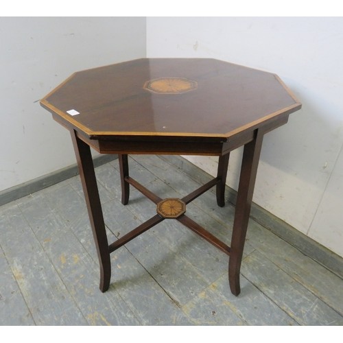 761 - A finely inlaid 19th century mahogany octagonal table with central fan medallions, ebony stringing a... 