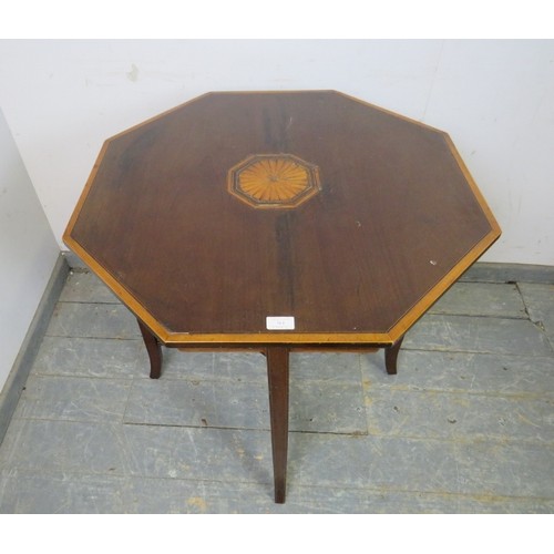 761 - A finely inlaid 19th century mahogany octagonal table with central fan medallions, ebony stringing a... 