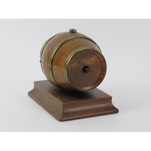 108 - A brass mounted oak string dispenser and cutter modelled as a coopered barrel. 12.6 cm length. 
Cond... 