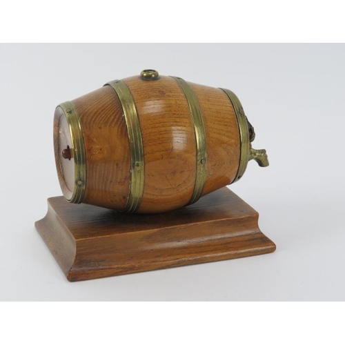 108 - A brass mounted oak string dispenser and cutter modelled as a coopered barrel. 12.6 cm length. 
Cond... 