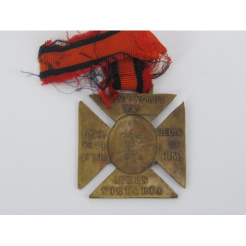 111 - A Queen Victoria's 1897 Diamond Jubilee cross pattée medal, a vintage English EMCA City police whist... 