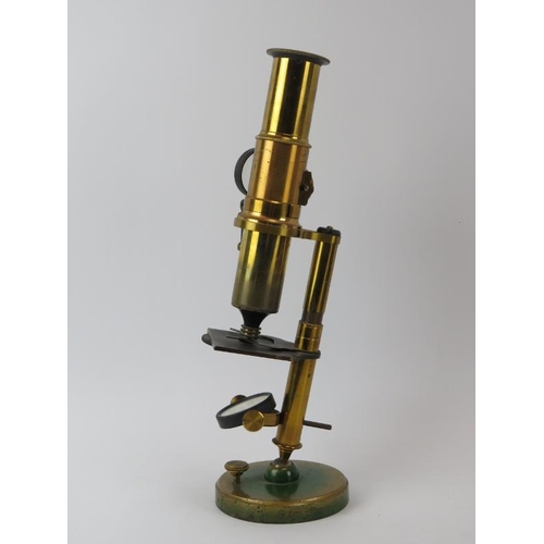 123 - An antique French Student’s microscope, mid/late 19th century. With a mahogany case. 28.2 cm approxi... 