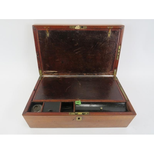 126 - A Victorian mahogany writing slope. With compartmented interior and external side draw. 42 cm length... 