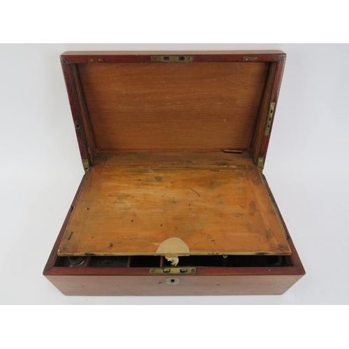 126 - A Victorian mahogany writing slope. With compartmented interior and external side draw. 42 cm length... 