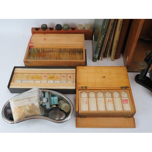 130 - An Ernst Lertz Wetzlar microscope with case, a collection of biological specimen glass slides, micro... 