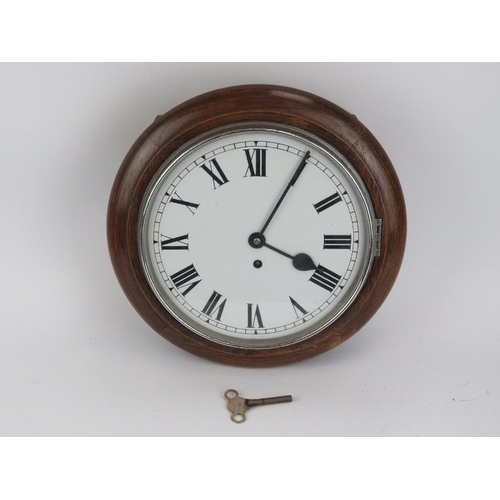 146 - An oak station style wall clock, 20th century. Key included. 34 cm diameter.
Condition report: Some ... 