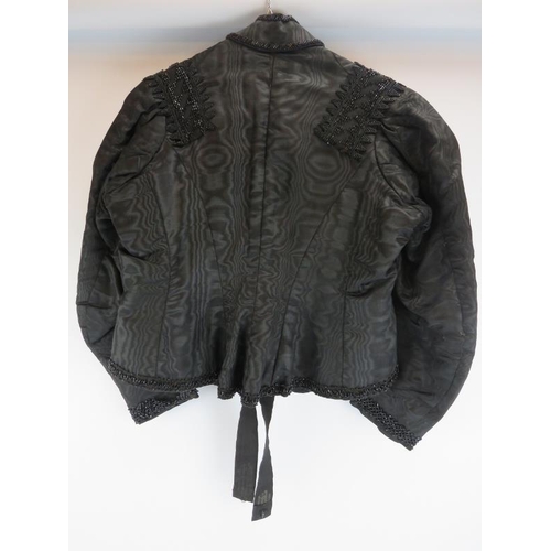 149 - A Victorian ladies satin and glass beaded embroidered jacket, late 19th century. 56 cm approximate l... 