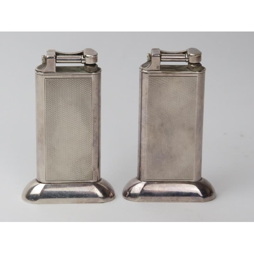 15 - Two vintage Dunhill chrome metal table lighters, mid 20th century. (2 items) 10.2 cm height.
Conditi... 