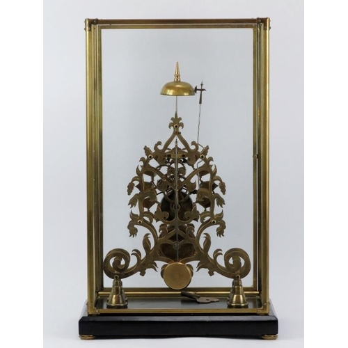 16 - A large 8-day brass skeleton clock, mid 20th century. With black enamelled numerals and chain driven... 