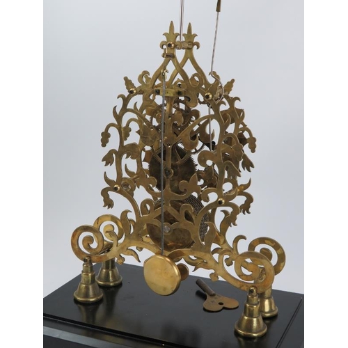 16 - A large 8-day brass skeleton clock, mid 20th century. With black enamelled numerals and chain driven... 