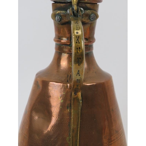 175 - A Middle Eastern brass and copper ewer, probably 19th century. in (cm) height. 
Condition report: So... 