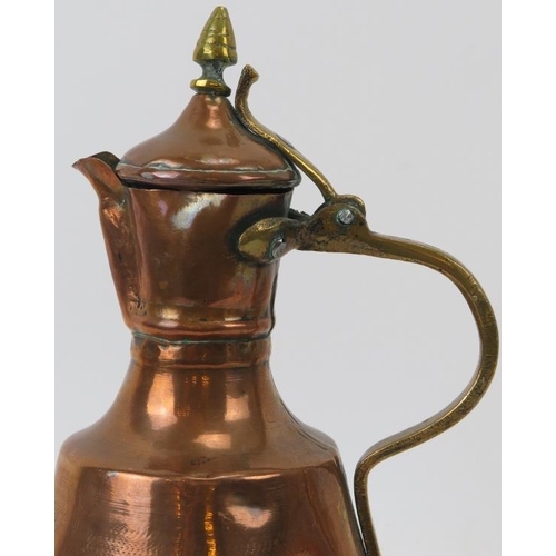 175 - A Middle Eastern brass and copper ewer, probably 19th century. in (cm) height. 
Condition report: So... 