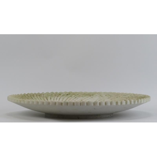 20 - A large carved marble dish, 19th/20th century. Decorated with a scalloped pattern radiating from the... 