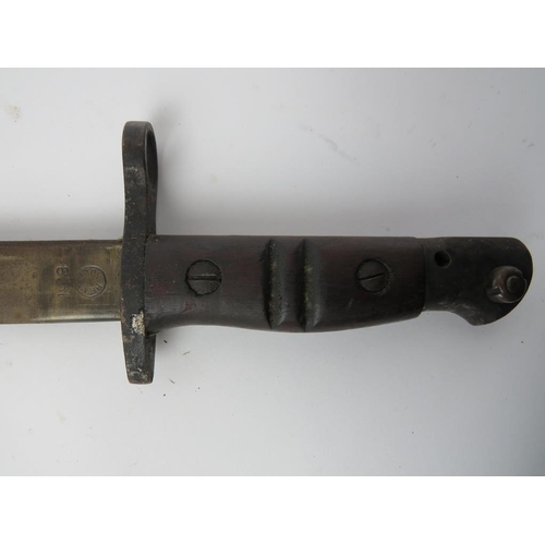 214 - An American WWI Remington 1918 bayonet. With steel mounted black leather scabbard. Marked to the ric... 