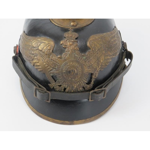 226 - An antique Prussian Officers Imperial Pickelhaube spiked helmet. 26 cm approximate length.
Condition... 