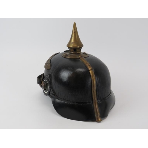 226 - An antique Prussian Officers Imperial Pickelhaube spiked helmet. 26 cm approximate length.
Condition... 