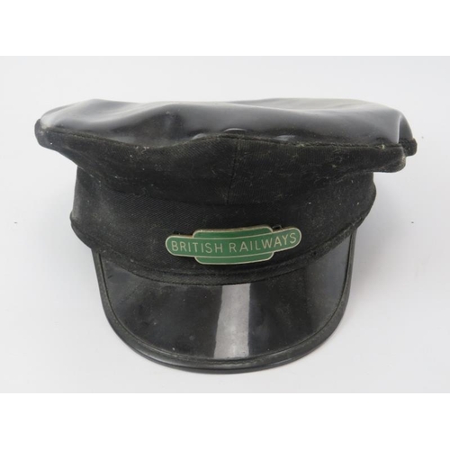 228 - A British Railways train driver's 'greasetop' cap. 28 cm approximate length.
Condition report: Some ... 