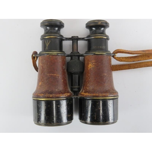 233 - Three pairs of WWII era binoculars. Barr & Stroud military issue binoculars, a French pair marked ‘P... 