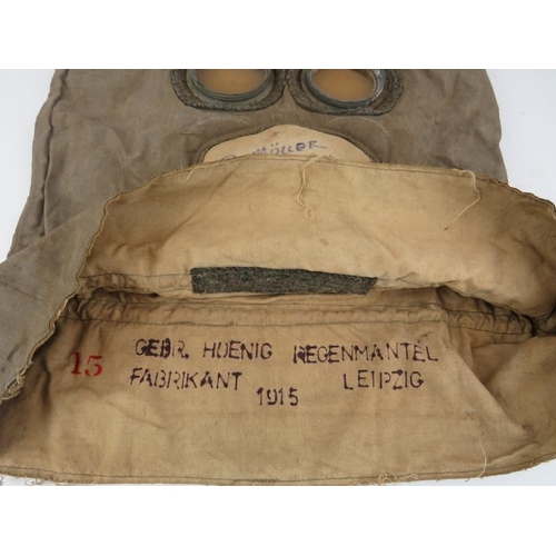 257 - A rare German WWI military anti gas helmet / hood. Internally inscribed ‘GEBR. HUENIG REGENMANTEL FA... 